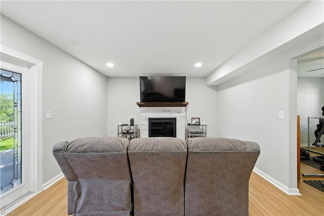1217 Etworth Ln, Virginia Beach, VA 23464 - living room with light wood-type flooring, a glass covered fireplace, and recessed lighting