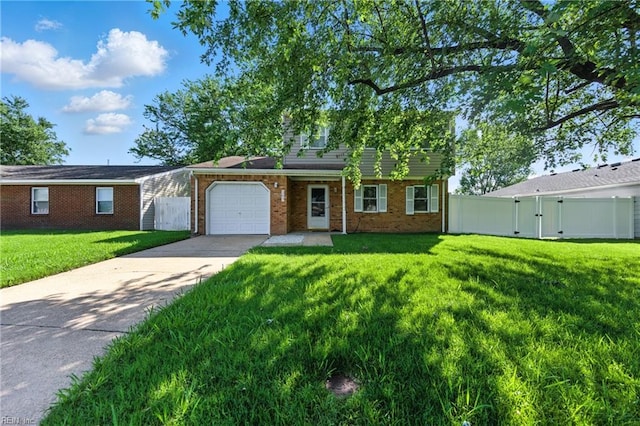 1217 Etworth Ln, Virginia Beach, VA 23464 - traditional-style house with a gate, an attached garage, concrete driveway, and brick siding