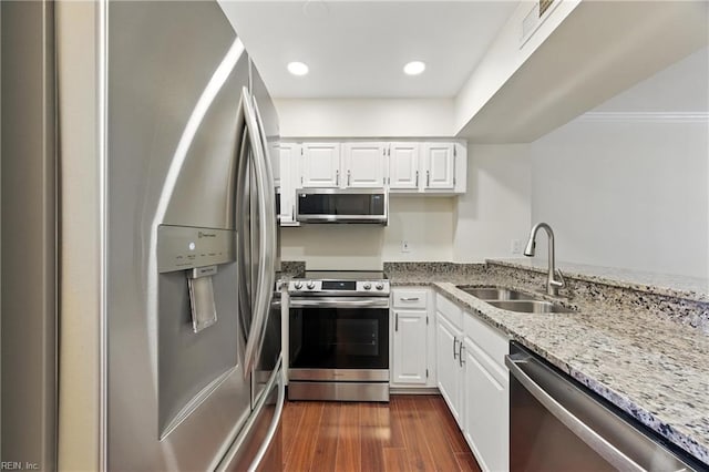 233 Mill Point Dr, Hampton, VA 23669 - kitchen featuring stainless steel appliances, light stone countertops, white cabinets, dark wood-style floors, and recessed lighting