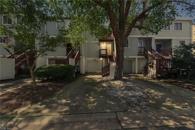 233 Mill Point Dr, Hampton, VA 23669 - view of front of property featuring stairway, concrete driveway, and an attached garage