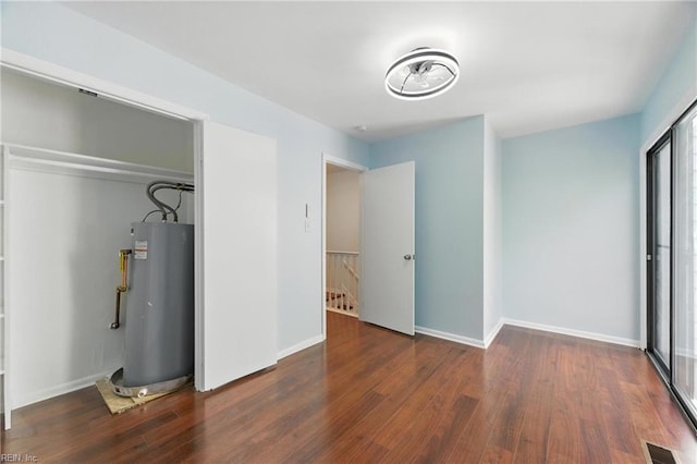 233 Mill Point Dr, Hampton, VA 23669 - unfurnished bedroom with water heater, wood finished floors, and a closet