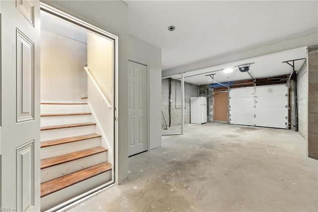 233 Mill Point Dr, Hampton, VA 23669 - garage with freestanding refrigerator and a garage door opener