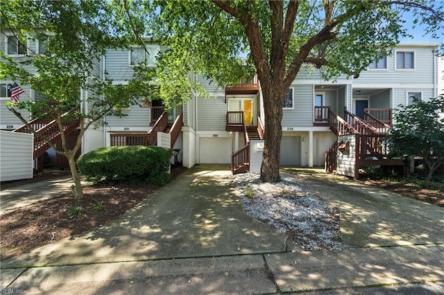 233 Mill Point Dr, Hampton, VA 23669 - view of front of home featuring stairs, concrete driveway, and an attached garage