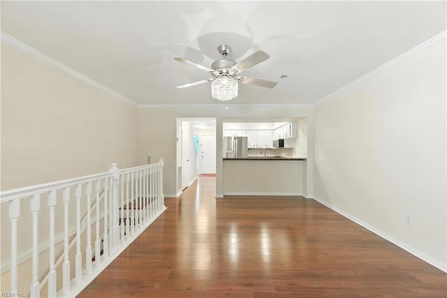 233 Mill Point Dr, Hampton, VA 23669 - unfurnished living room featuring dark wood-type flooring, crown molding, and ceiling fan