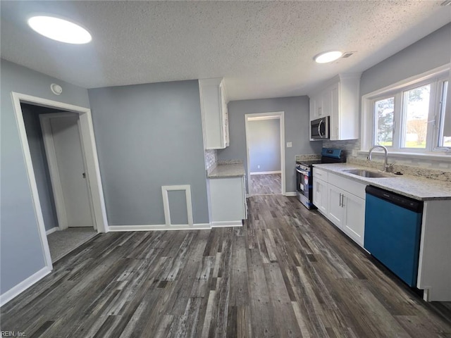 4833 Linshaw Ln, Virginia Beach, VA 23455 - kitchen with stainless steel appliances, white cabinetry, dark wood-type flooring, and a textured ceiling