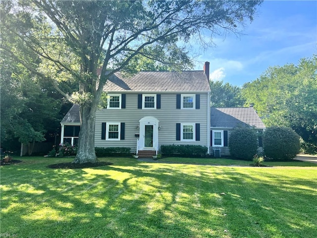 11 Elm Ave, Newport News, VA 23601 - colonial inspired home with entry steps, a chimney, and a front lawn