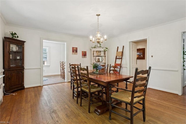 11 Elm Ave, Newport News, VA 23601 - dining space featuring a chandelier, ornamental molding, and wood finished floors