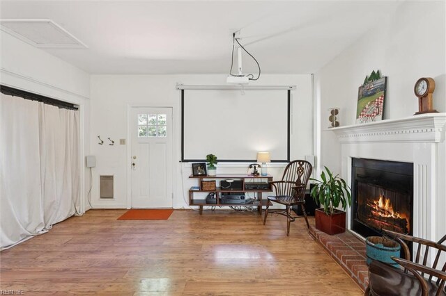 11 Elm Ave, Newport News, VA 23601 - entrance foyer featuring wood finished floors and a warm lit fireplace