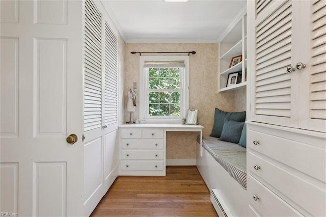 11 Elm Ave, Newport News, VA 23601 - home office featuring ornamental molding, wood finished floors, a baseboard heating unit, and built in desk
