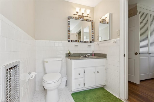 11 Elm Ave, Newport News, VA 23601 - bathroom with tile walls, vanity, and wainscoting