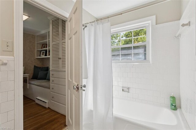 11 Elm Ave, Newport News, VA 23601 - full bath with a baseboard heating unit, shower / bath combination with curtain, and wood finished floors