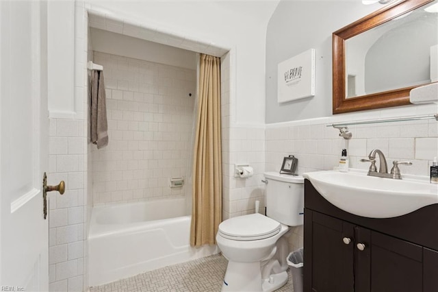 11 Elm Ave, Newport News, VA 23601 - bathroom with vanity, shower / tub combo with curtain, tile patterned floors, a wainscoted wall, and tile walls