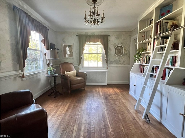 11 Elm Ave, Newport News, VA 23601 - living area with radiator, wood finished floors, a chandelier, and ornamental molding