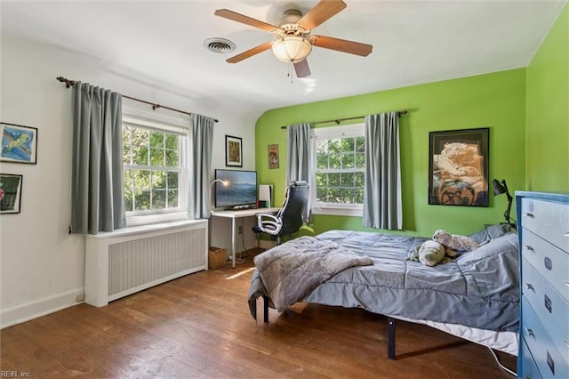 11 Elm Ave, Newport News, VA 23601 - bedroom featuring radiator, wood finished floors, and a ceiling fan