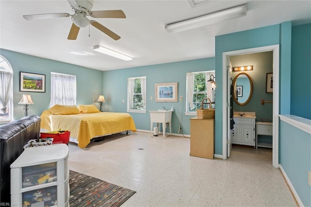 11 Elm Ave, Newport News, VA 23601 - bedroom with ensuite bathroom, tile patterned floors, and a ceiling fan