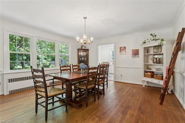 11 Elm Ave, Newport News, VA 23601 - dining space featuring a chandelier, radiator, wood finished floors, and ornamental molding