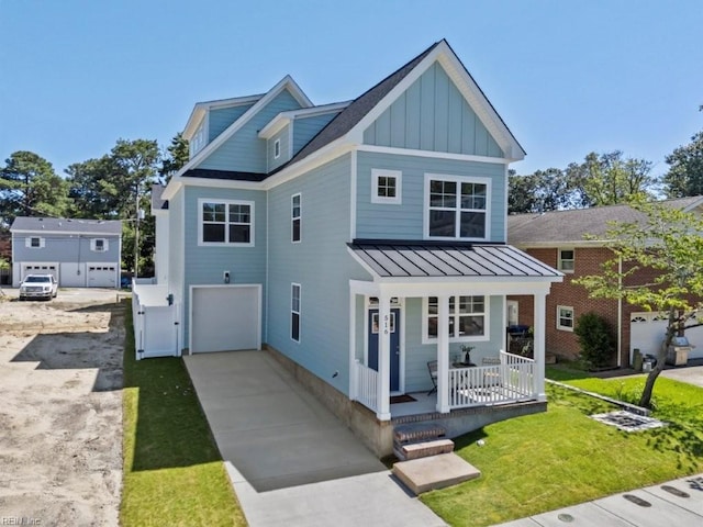 516 26th St, Virginia Beach, VA 23451 - view of front of house with a porch, a standing seam roof, board and batten siding, a garage, and a metal roof