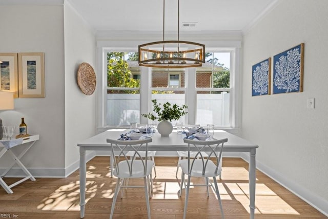516 26th St, Virginia Beach, VA 23451 - dining space featuring crown molding, wood finished floors, and a chandelier