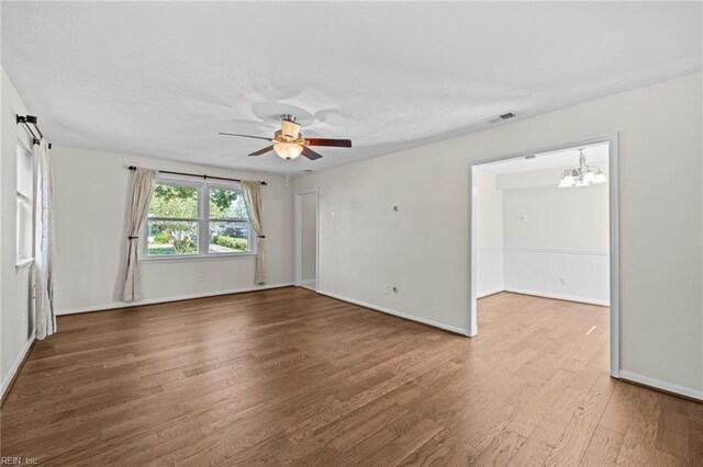 596 Old Post Rd, Virginia Beach, VA 23452 - spare room with wood finished floors, ceiling fan, and a chandelier