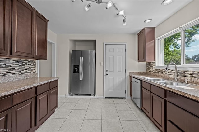 596 Old Post Rd, Virginia Beach, VA 23452 - kitchen with appliances with stainless steel finishes, backsplash, light tile patterned floors, and dark brown cabinetry