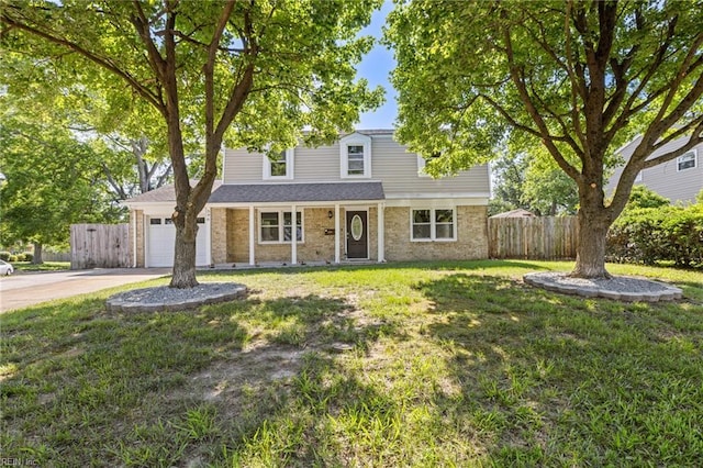 596 Old Post Rd, Virginia Beach, VA 23452 - traditional-style house featuring driveway, a garage, and brick siding