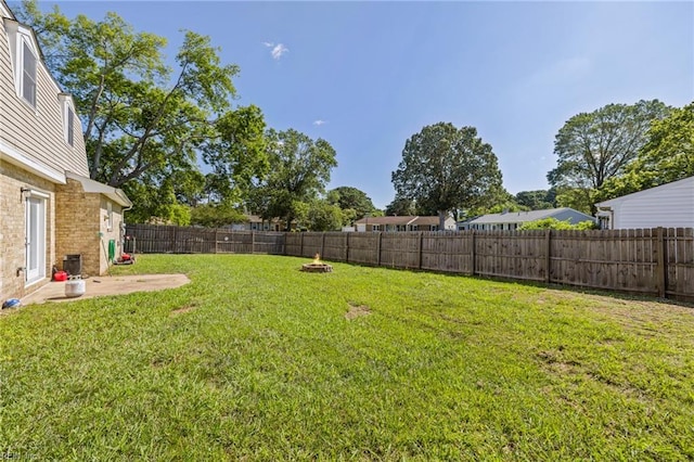 596 Old Post Rd, Virginia Beach, VA 23452 - fenced backyard with an outdoor fire pit