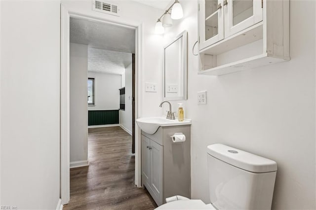 1521 Peabody Dr, Hampton, VA 23666 - half bathroom featuring vanity, wood finished floors, and a textured ceiling