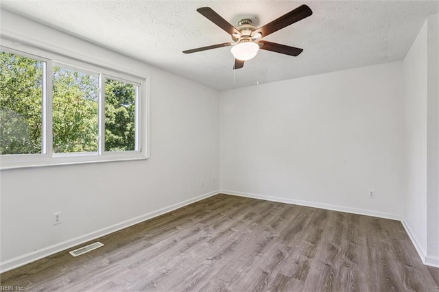 1521 Peabody Dr, Hampton, VA 23666 - unfurnished room with a textured ceiling, wood finished floors, and a ceiling fan