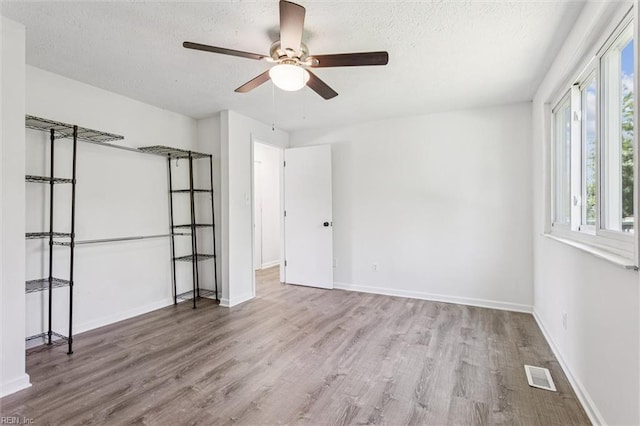 1521 Peabody Dr, Hampton, VA 23666 - unfurnished bedroom with wood finished floors, a textured ceiling, and ceiling fan