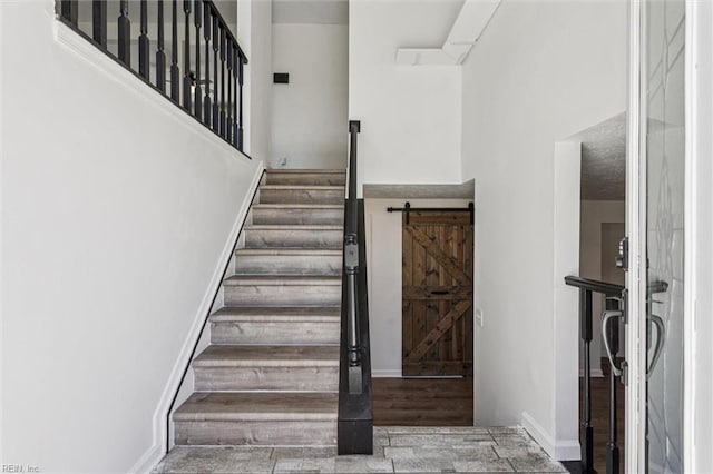 1521 Peabody Dr, Hampton, VA 23666 - stairway with a barn door and wood finished floors