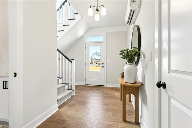 1906 Mccoy Rd, Chesapeake, VA 23323 - foyer with stairs, wood finished floors, and a wall unit AC