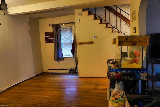 1300 Cass St, Norfolk, VA 23523 - living area featuring wood finished floors, arched walkways, stairs, and baseboard heating