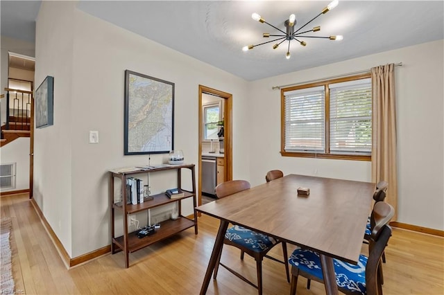 2218 Haywood Ave, Chesapeake, VA 23324 - dining room with light wood-type flooring and a chandelier
