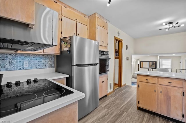 2218 Haywood Ave, Chesapeake, VA 23324 - kitchen featuring black appliances, light wood-style flooring, light countertops, backsplash, and light brown cabinets