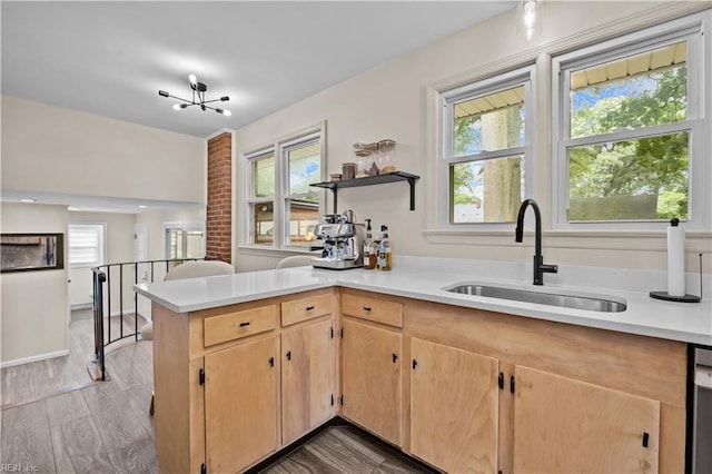 2218 Haywood Ave, Chesapeake, VA 23324 - kitchen featuring light countertops, light brown cabinets, a peninsula, and wood finished floors