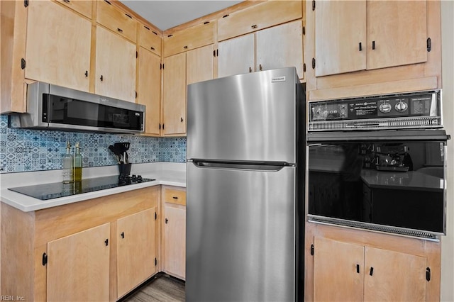 2218 Haywood Ave, Chesapeake, VA 23324 - kitchen with black appliances, light brown cabinetry, and backsplash