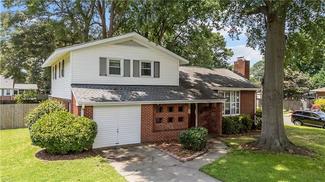 2218 Haywood Ave, Chesapeake, VA 23324 - view of front of home with brick siding, a garage, concrete driveway, a shingled roof, and a chimney
