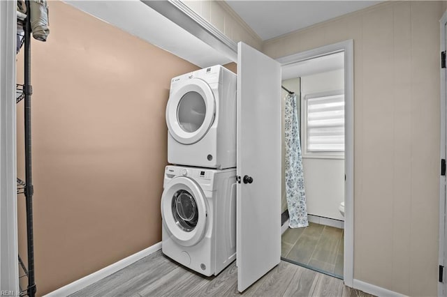 2218 Haywood Ave, Chesapeake, VA 23324 - laundry room with estacked washer and dryer, wood finished floors, and crown molding