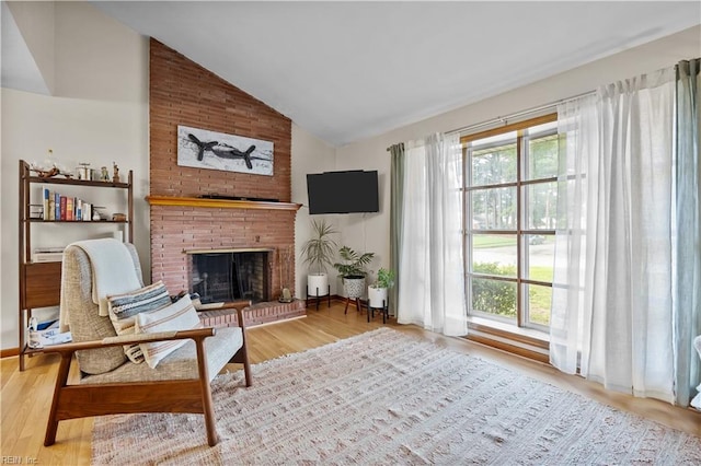 2218 Haywood Ave, Chesapeake, VA 23324 - sitting room with vaulted ceiling, plenty of natural light, a fireplace, and wood finished floors