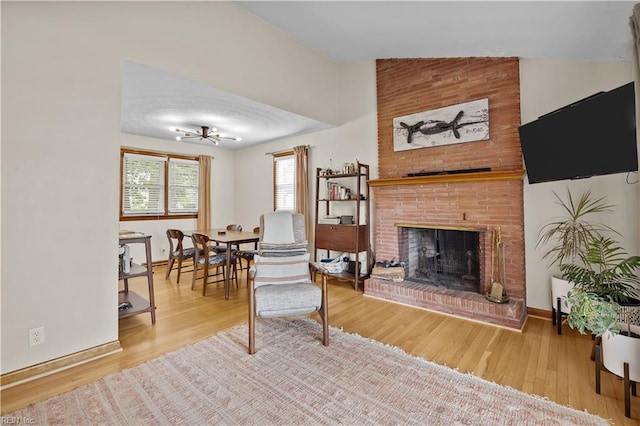 2218 Haywood Ave, Chesapeake, VA 23324 - living area with a fireplace, wood finished floors, and lofted ceiling