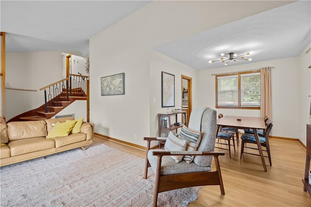 2218 Haywood Ave, Chesapeake, VA 23324 - living area featuring a chandelier, light wood-style floors, and stairs