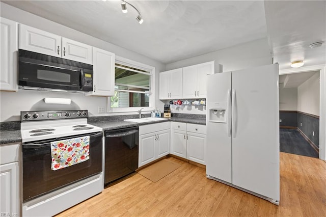 16 Diggs Dr, Hampton, VA 23666 - kitchen with black appliances, dark countertops, and white cabinets