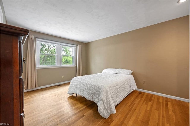 16 Diggs Dr, Hampton, VA 23666 - bedroom with baseboards and light wood-type flooring