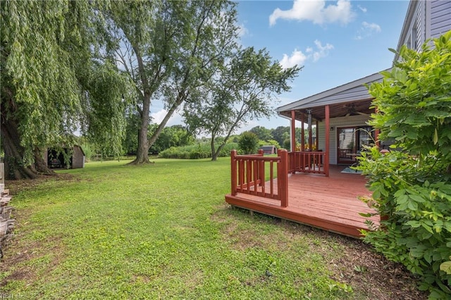 16 Diggs Dr, Hampton, VA 23666 - view of green lawn with a ceiling fan and a wooden deck