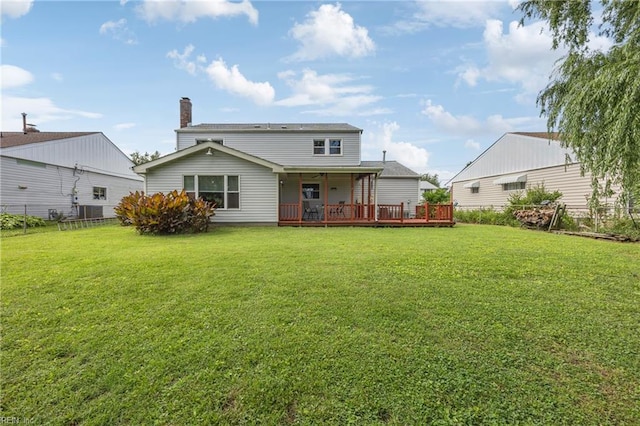16 Diggs Dr, Hampton, VA 23666 - rear view of property with a wooden deck and a chimney