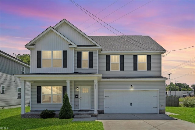 208 Parkdale Ave, Hampton, VA 23669 - view of front facade with board and batten siding, an attached garage, covered porch, concrete driveway, and a yard