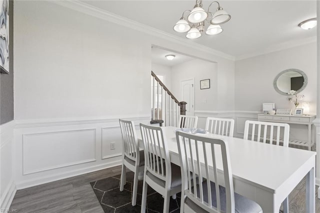 208 Parkdale Ave, Hampton, VA 23669 - dining area featuring crown molding, a chandelier, a decorative wall, wainscoting, and wood finished floors