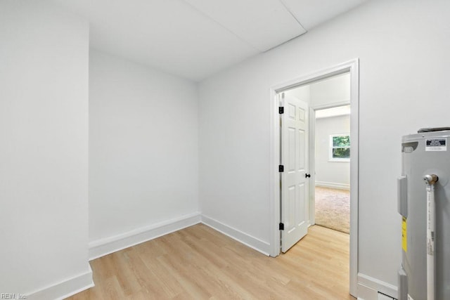 3144 Aaron Dr, Chesapeake, VA 23323 - empty room featuring light wood-style flooring and electric water heater