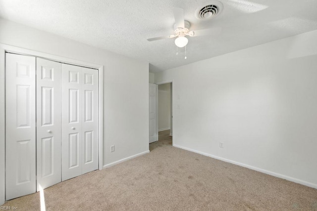 3144 Aaron Dr, Chesapeake, VA 23323 - unfurnished bedroom featuring carpet floors, a closet, a textured ceiling, and a ceiling fan