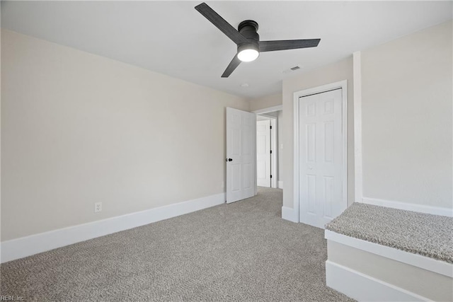 10 Church St, Windsor, VA 23487 - unfurnished bedroom featuring light colored carpet, a closet, and a ceiling fan
